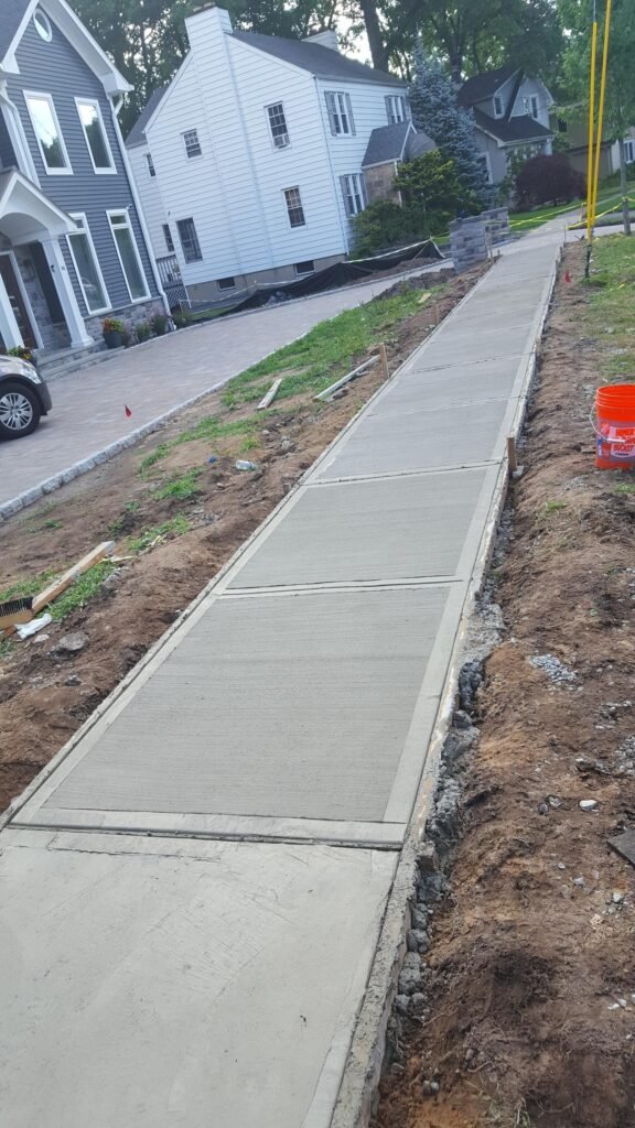 New exterior walkway installed during a property improvement project