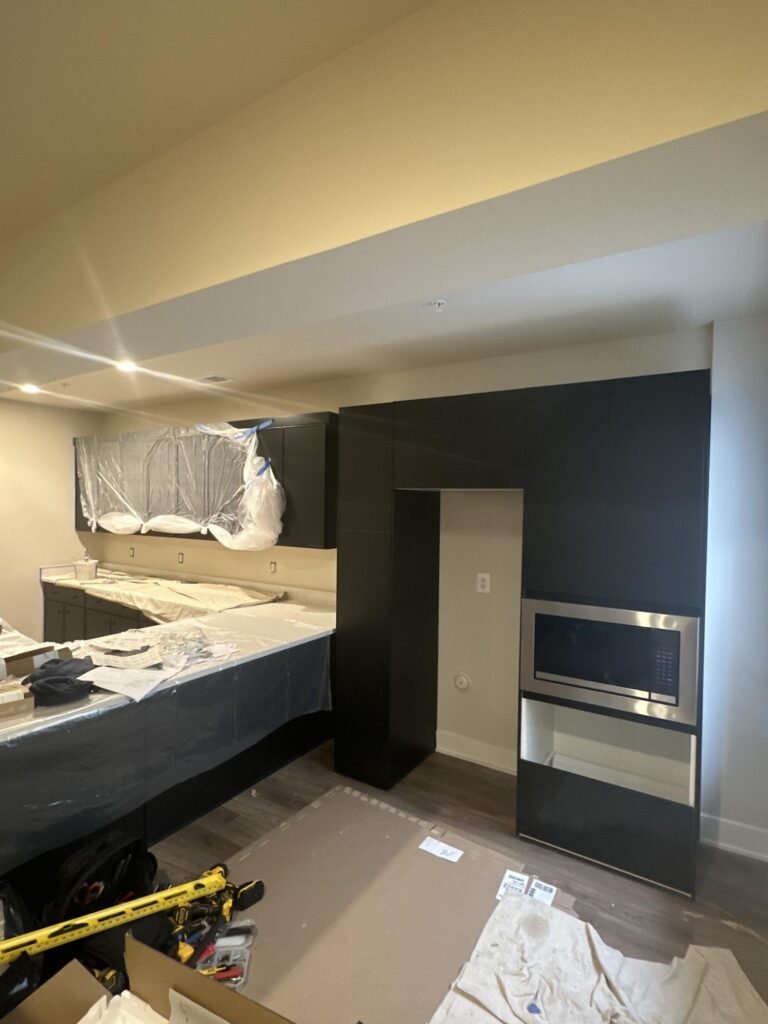 Kitchen renovation in progress during cabinet installation