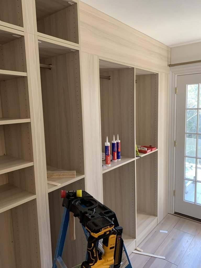Custom built-in shelving being installed by ZEFI GROUP