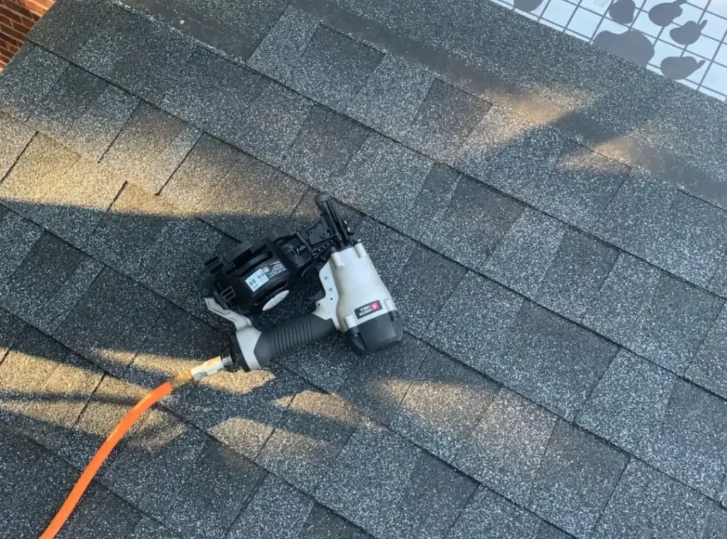 Asphalt shingle installation with a roofing nail gun